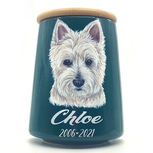 A cremation urn with a hand-painted Pet portrait
