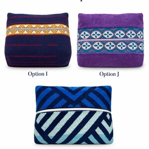 May include: Three rectangular pouches labeled Pouch Options. Option I is dark blue with orange and white geometric embroidery. Option J is purple with a teal and white floral-like pattern. Option K features a blue and light blue diagonal stripe design.