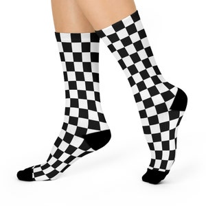 May include: A pair of black and white checkered socks. The socks are made of a soft, comfortable material and are perfect for everyday wear.