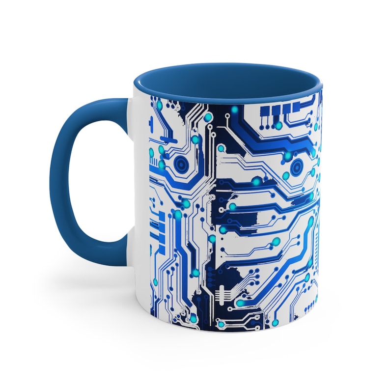 May include: A white ceramic mug with a blue interior and a blue and white circuit board design. The mug is perfect for coffee, tea, or hot chocolate.