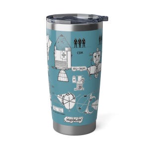 May include: A stainless steel tumbler with a blue background and a white illustration of a spacecraft. The illustration includes the text "CSM".