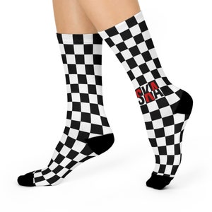 May include: Black and white checkered socks with the word "SKA" in red letters on one sock.