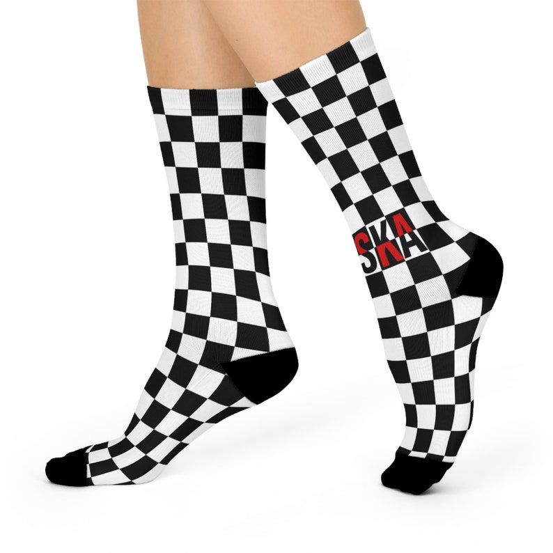 May include: Black and white checkered socks with the word "SKA" in red letters on one sock.