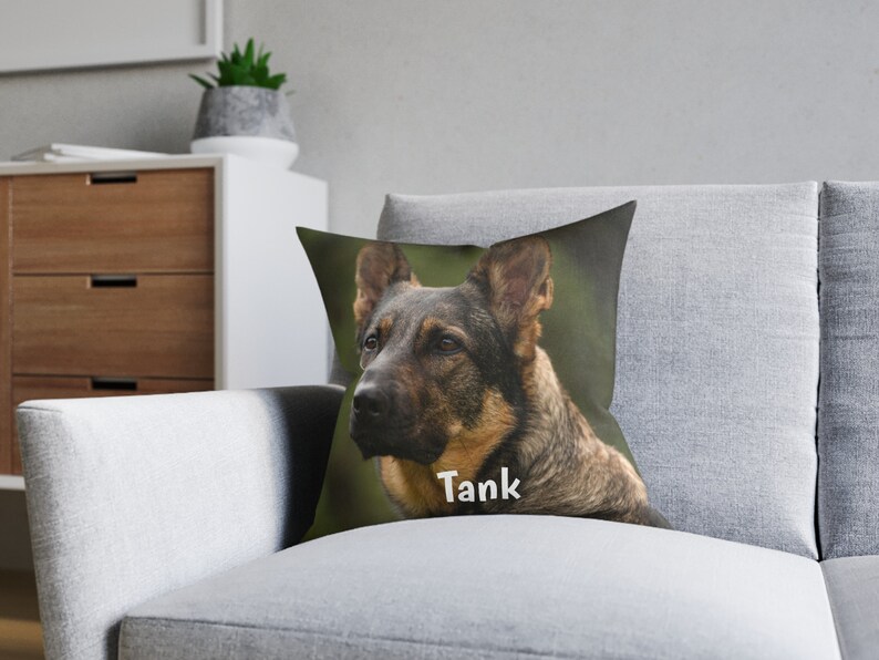 May include: A throw pillow with a close-up image of a German Shepherd dog with brown and black fur. The dog is looking to the right of the image. The text "Tank" is printed on the pillow below the dog's head.