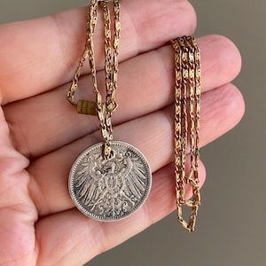 Antique sentimental pendant made of a 1 silver (900) German mark coin from 1915 on a delicate brass chain