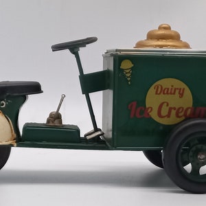 Charm Your Space with Vintage Elegance – Handmade Metal Ice Cream Cart Piggy Bank