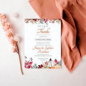 May include: A Thanksgiving dinner invitation with a watercolor illustration of fall leaves, pumpkins, and berries. The invitation reads "let's give thanks" and includes the date, time, and location of the dinner. It also requests guests to bring their favorite dish to share.