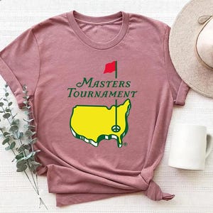 May include: A set of three ceramic mugs with a speckled, matte finish. The mugs are in shades of cream, light gray, and dark gray. Each mug has a simple, minimalist design, perfect for coffee or tea.