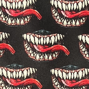 May include: A black background with a repeating pattern of a white and yellow set of teeth with a red tongue sticking out.