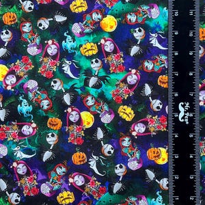 May include: A black fabric with a repeating pattern of Jack Skellington and Sally from the Nightmare Before Christmas. The pattern also includes pumpkins, ghosts, and other Halloween imagery. The fabric is printed with a watercolor effect.