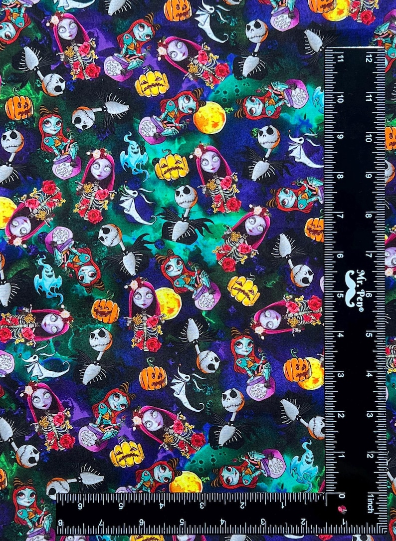 May include: A black fabric with a repeating pattern of Jack Skellington and Sally from the Nightmare Before Christmas. The pattern also includes pumpkins, ghosts, and other Halloween imagery. The fabric is printed with a watercolor effect.