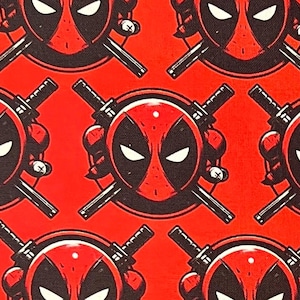 May include: Red background with a repeating pattern of black and red Deadpool masks with crossed swords. The masks have white eyes and a black outline.