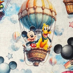 May include: A whimsical fabric design featuring Mickey Mouse and Pluto in a hot air balloon. The balloon is a mix of blue, orange, and tan, with a woven basket. The background includes clouds, stars, and other balloons, creating a cheerful, cartoon-like scene.