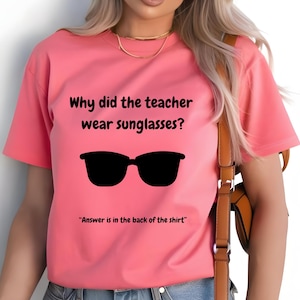 Funny Teacher T-Shirt, "Bright Students" Graphic Tee, Unisex Shirt with Quote: Why did the teacher wear sunglasses? a black sunglasses is designed in the apparel. *Answer is in the back of the shirt - Because her students sere so bright! Female model wearing blossom color t-shirt.