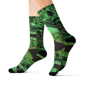 May include: Green and black socks with a circuit board pattern.