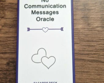 May include: A deck of oracle cards with a white background and a purple border. The text "No Communication Messages Oracle" is at the top. Below the text is a line with a heart and arrows. Two hearts are at the bottom. The text "54 CARDS DECK" is at the bottom.