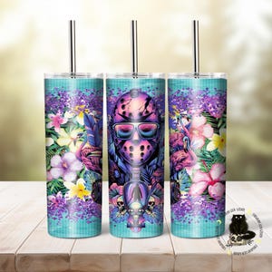 May include: Three stainless steel tumblers with lids and straws. The tumblers are decorated with a tropical floral pattern and a masked figure wearing sunglasses. The tumblers are on a wooden surface.