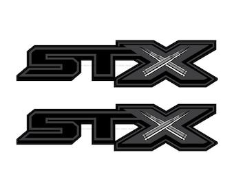 May include: Two black and gray decals with the word "STX" and a pair of crossed bullets in the center.