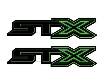 May include: Two STX logo decals. Each decal features the word "STX" in black with a green outline and a green "X" design. The decals are on a white background.
