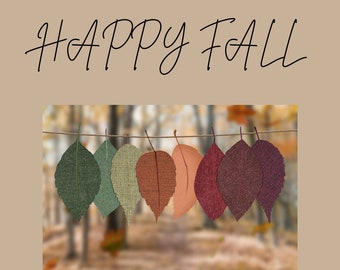 May include: Happy Fall greeting with a string of seven fabric leaves in various fall colors hanging against a blurred background of trees.