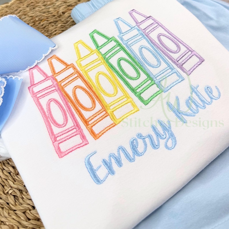 Colorful crayon silhouettes with 'Emery Kate' text on a white background