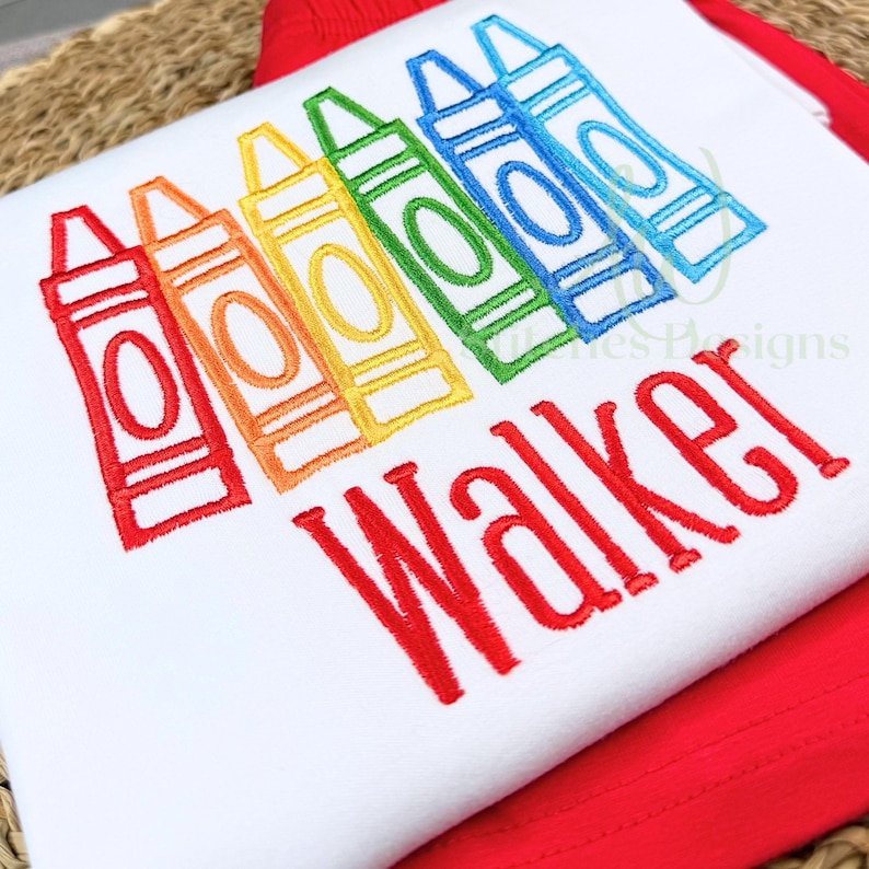 White shirt with colorful crayon design and 'Walker' text on a red background