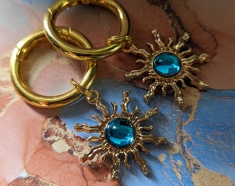 Gold green and blue sun boot charms