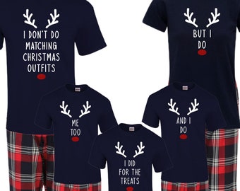 May include: A set of four navy blue pajamas with red and black plaid pants. The shirts feature a white reindeer design with the text "I don't do matching Christmas outfits", "But I do", "Me too", "I did for the treats", and "And I do".