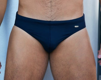 May include: A black swimsuit with a small silver logo on the side.