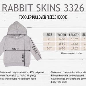 May include: A light gray toddler pullover fleece hoodie with a hood, ribbed cuffs, and waistband. The image includes size measurements in inches for 2T, 4T, and 5-6T sizes. The hoodie is made of a medium-weight fabric.