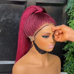 May include: A white ceramic mug with a black handle and the text "But First, Coffee" in a black, bold font. The mug is sitting on a white surface. The mug is approximately 4 inches tall.