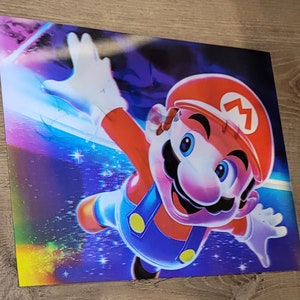 May include: A vibrant print featuring Mario in a dynamic pose against a colorful, space-themed background. Mario is depicted with his signature red hat with a white "M", blue overalls, and white gloves. The artwork has a glossy finish.