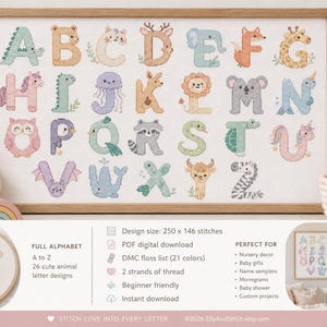 May include: A cross-stitch alphabet sampler in a wooden frame, with each letter from A to Z depicted as an animal. The design includes a bear, a deer, a giraffe, and a unicorn. The image text reads "FULL ALPHABET A to Z 26 cute animal letter designs".