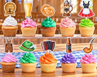 May include: Ten cupcakes arranged on a clear stand, each topped with a colorful frosting swirl and a decorative paper topper featuring Oktoberfest-themed icons including a beer barrel, glass of beer, pretzel, stein, dirndl, lederhosen, hat, accordion, bottle, and pipe.