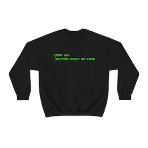 May include: Black sweatshirt with green text that reads "ERROR 404: CHRISTMAS SPIRIT NOT FOUND".