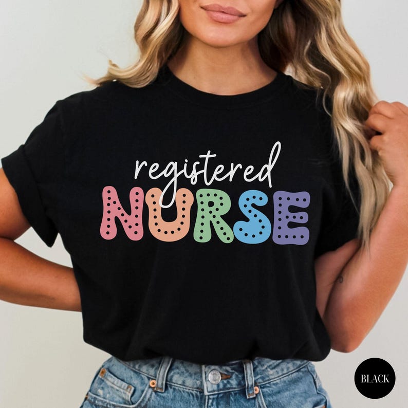 May include: Black t-shirt with the text "registered NURSE" in rainbow colors with black polka dots.