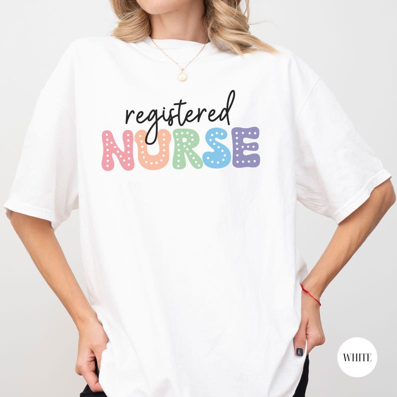 May include: White t-shirt with the text "registered NURSE" in rainbow letters with white polka dots.