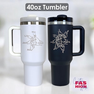 May include: Two 40oz tumblers, one white and one black, with handles and lids. The white tumbler has the word "DAD" and names around a fist graphic. The black tumbler has the word "PAPA" and names around a fist graphic. The text "40oz Tumbler" is at the top.
