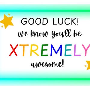 May include: A turquoise border surrounds a white card with the text "GOOD LUCK! we know you'll be XTREMELY awesome!" in black. The word "XTREMELY" is in rainbow colours. Two yellow stars are on either side of the text.