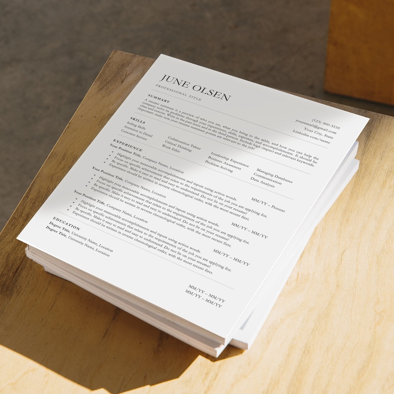 May include: A black and white resume with the name June Olsen at the top. The resume includes a summary, skills, experience, and education sections.