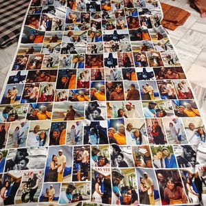 May include: A white fabric blanket covered in numerous small photographs. The photos are of various sizes and feature people in different settings. The blanket is rectangular and appears to be made of a soft material.