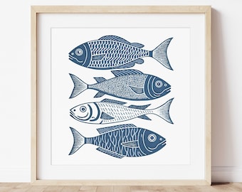 May include: A framed print of four stylized blue fish swimming in a row against a white background.