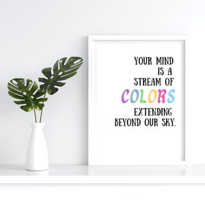 May include: A white framed print with the text "Your mind is a stream of colors extending beyond our sky." The word "colors" is written in rainbow colors.