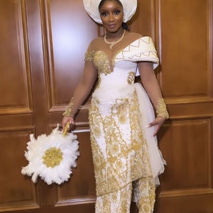 African couple traditional wedding outfit, White and gold George Dress, luxurious George Dress, Lace style,Royal clothing, Igbo bride attire