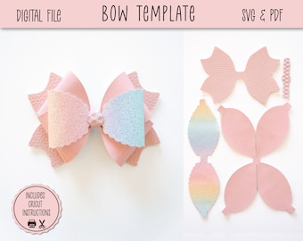 May include: A pink bow template with a glittery rainbow design. The template includes SVG and PDF files for cutting on a Cricut machine. The image shows the finished bow and the individual pieces of the template.