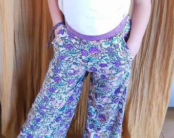 flowing pants with flowers and purple glittery elastic