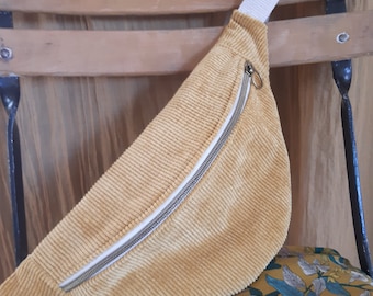 Bright yellow corduroy fanny pack with gold trim