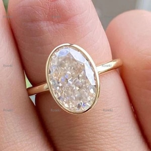 Vintage Oval Moissanite Engagement Ring: 14K Yellow Gold Bezel Solitaire