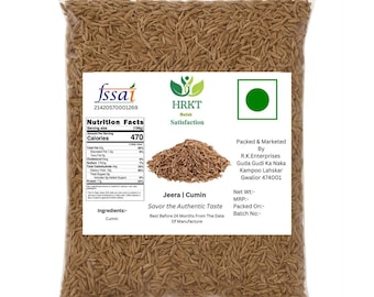 May include: A clear plastic bag filled with cumin seeds. The bag has a white label with nutritional information, the text "Jeera | Cumin", and the words "Savor the Authentic Taste". The bag is sealed.