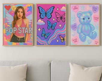 May include: Three framed art prints. The first features a woman with the text "POP STAR". The second has butterfly illustrations. The third print shows a blue teddy bear with heart-shaped text bubbles that say "Love You" and "Kiss Me".